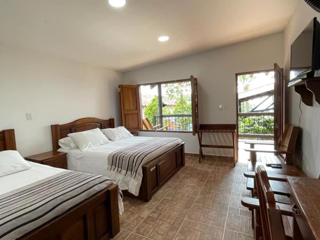 Hotel Bosques Del Saman Alcala Кимбайя Экстерьер фото